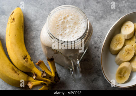 Milky Banana Smoothie in Mason Jar with Milk (Milkshake). Organic Fresh Beverage Stock Photo