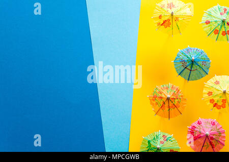 Overhead view on beach with umbrellas and sea with boats. Sea travel and summer vacation minimal concept. Paper origami composition. Flat lay. Top vie Stock Photo