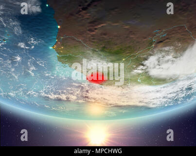 Sierra Leone during sunrise highlighted in red on planet Earth with ...