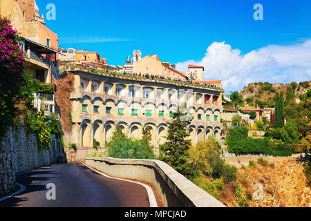 Road along the rock in Taormina city, Sicily, Italy Stock Photo