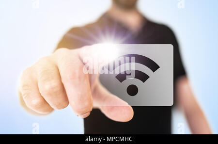 wireless technology concept with man touching wifi icon on translucent screen interface Stock Photo