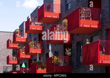 Germany, Cologne, red balconies of the apartment building Clouth 3 in the Clouth quarter in the district Nippes, Kister Scheithauer Gross Architects.  Stock Photo
