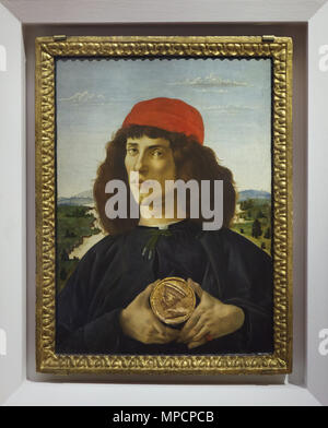 Painting 'Portrait of a young man holding a medallion' by Italian Renaissance painter Sandro Botticelli dated from circa 1475 on display in the Uffizi Gallery (Galleria degli Uffizi) in Florence, Tuscany, Italy. Stock Photo