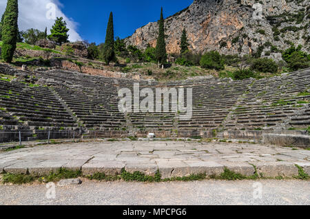 Delphi Town, Phocis - Greece. Facade view of the Ancient Theater of Delphi at the archaeological site of Delphi. Stock Photo