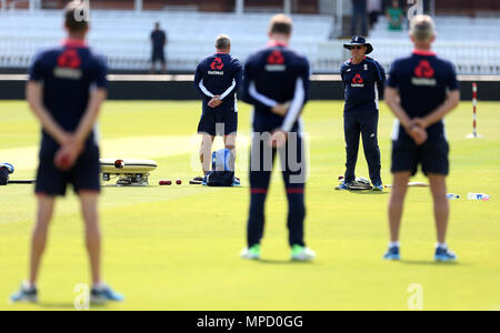 England head coach Trevor Bayliss and players hold a minute's silence in memory of the victims of the Manchester bombings during the nets session at Lord's, London. Stock Photo