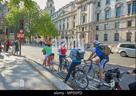 Commuters cycling to work on an urban street Stock Photo