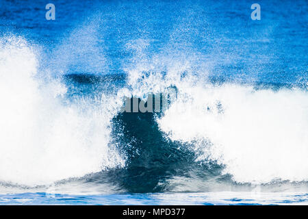 Clean energy from the wave in blue ocean. Beautiful power and destruction like tsunami. Tenerife nature. Stock Photo
