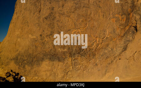 Cave paintings and petroglyphs aka crying cow at Tegharghart in Tassili nAjjer national park, Algeria Stock Photo