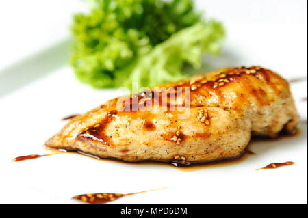 Chicken grilled steak with vegetables on a white plate. Stock Photo