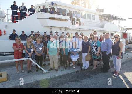 The decsendants of Bailey Barco, keeper of Dam Neck Lifesaving Station, pose for a photo with the crew of the Coast Guard Cutter Bailey Barco Tuesday, Feb. 7, 2017 at the signing over ceremony to the Coast Guard in Key West, Florida. The cutter Bailey Barco, the 22nd 154-foot Fast Response Cutter in the Coast Guard fleet, will be homeported in Ketchikan, Alaska.  U.S. Coast Guard photo by Petty Officer 2nd Class Jonathan Lally. Stock Photo