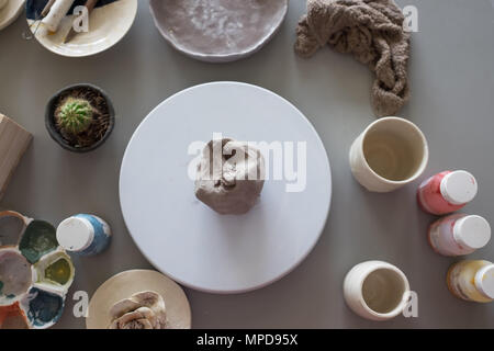 Preparing to do a cup from clay ball. Top view. Stock Photo