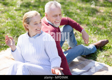 Cheerful delighted couple having a picnic Stock Photo