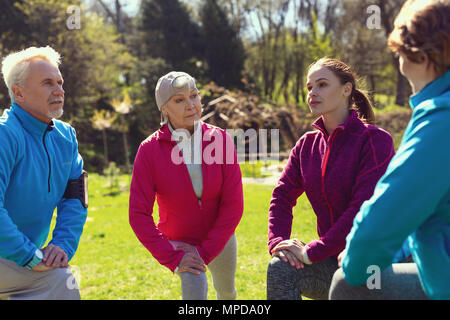 Determined people exercising in the park Stock Photo