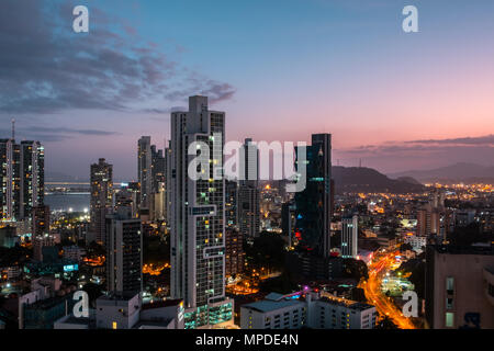 modern city skyline with sunset sky - skyscraper cityscape of Panama City Stock Photo