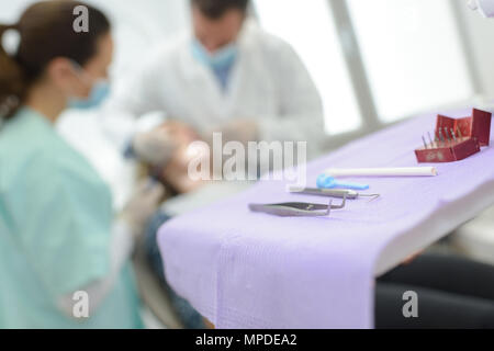 surgeons with tools on table Stock Photo