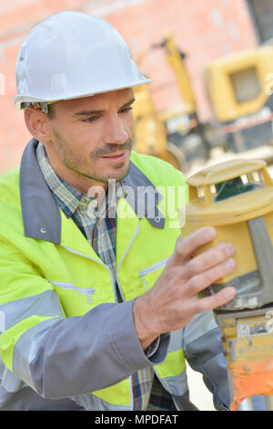 electrician builder engineer checking data Stock Photo