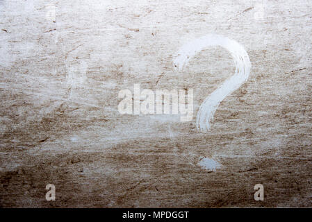 question mark is drawn on scratched dirty background Stock Photo