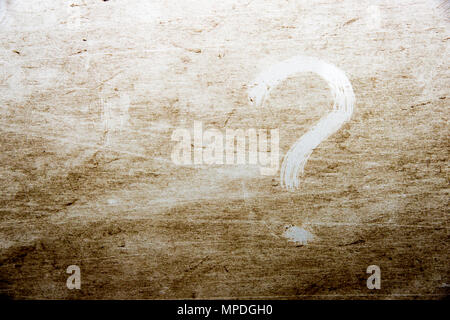 question mark is drawn on scratched dirty background Stock Photo
