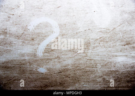 question mark is drawn on scratched dirty background Stock Photo