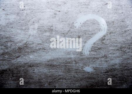question mark is drawn on scratched dirty background Stock Photo