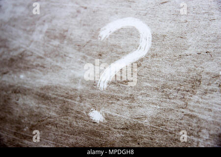 question mark is drawn on scratched dirty background Stock Photo