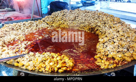 Turkish tavuk kavurma / roasted chicken pieces in pan turkish food concept. Stock Photo