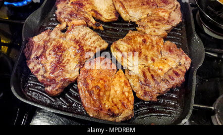 Fried Beef Steak in frying pan. Restaurant food concept. Stock Photo