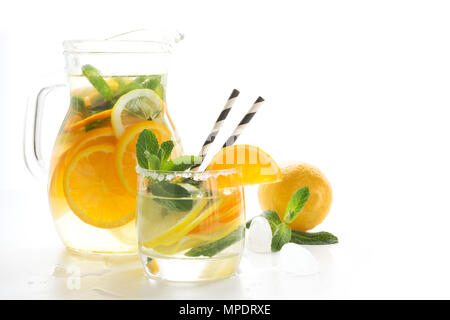 Summer fruits lemonade with ice and mint on white. Close up. Isolated. Stock Photo