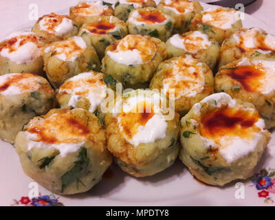 Turkish Potato Dumplings (Manti) with Yogurt and Sauce / Patates Mantisi. Traditional Food. Stock Photo