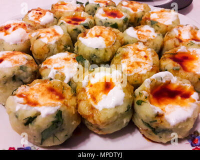 Turkish Potato Dumplings (Manti) with Yogurt and Sauce / Patates Mantisi. Traditional Food. Stock Photo