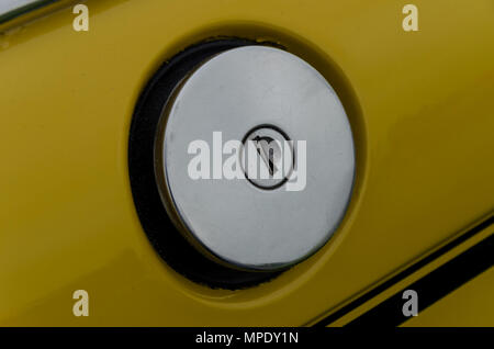 Retro chorme car petrol filler cap with key slot Stock Photo