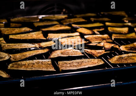 Cooking eggplant slices in the oven. organic food concept. Stock Photo
