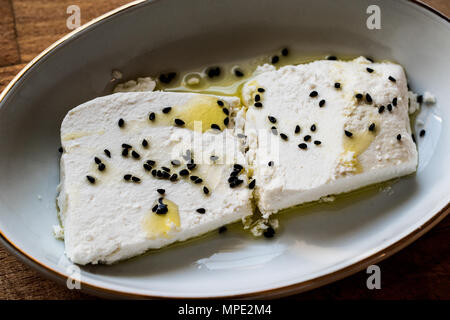 Cokelek or lor peyniri / Curd Cheese with olive oil and black cumin. Organic Food. Stock Photo