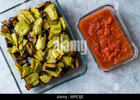 Turkish Food Kizartma / Fried Aubergine or Eggplant Slices with Tomato Paste Salsa Sauce in Glass Bowl. Traditional Food. Stock Photo