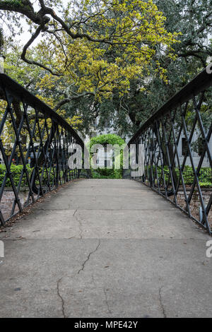 Wrought iron railing in a garden Stock Photo - Alamy