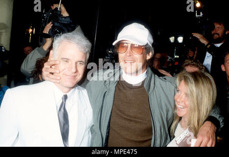 CENTURY CITY, CA - FEBRUARY 5: (L-R) Actor Steve Martin, actor Chevy Chase and wife writer Jayni Chase attend 'LA Story' Premiere on February 5, 1991 at Cineplex Odeon Century City Cinemas in Century City, California. Photo by Barry King/Alamy Stock Photo Stock Photo