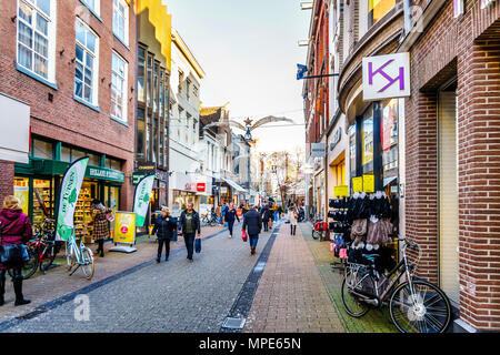 One of the many typical Dutch shopping streets in the famous city centre of the historic city of Zwolle, in the Netherlands. Stock Photo