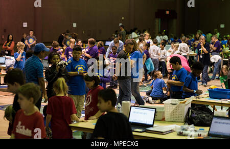 Students at the Regional Autonomous Robotics Circuit in Bossier City, Louisiana, adjust and test their robots on February 11, 2017. The event emphasizes science, technology, engineering, mathematics, and cyber skills while students compete in divisions, solving complex tasks and demonstrating teamwork, programming, and problem-solving capabilities. Stock Photo