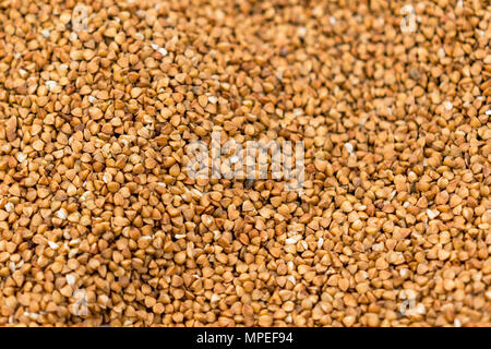 Dark Buckwheat texture high-quality photo of premium buckwheat groats. Selected focus. Stock Photo