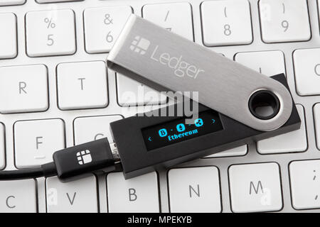 Ledger hardware wallet for cryptocurrency with Ethereum coin selection on display Stock Photo