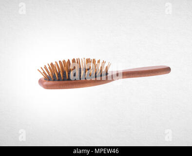 Hairbrush or Wooden Hairbrush on a background Stock Photo