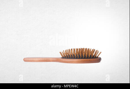 Hairbrush or Wooden Hairbrush on a background Stock Photo