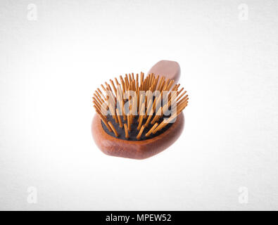 Hairbrush or Wooden Hairbrush on a background Stock Photo