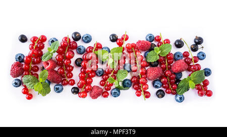 Mix berries isolated on a white. Ripe blueberries, red currants, black currant and raspberries. Berries and fruits with copy space for text. Various f Stock Photo