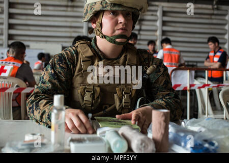 U.S. Navy Hospital Corpsman Third Class Shannon Muniz,  Combat Logistics Battalion 4, commands the medical  station during a non-combatant evacuation operation  exercise during Cobra Gold 2017 at Utapao International  Airport in Rayong Province, Thailand, Feb. 19, 2017. Cobra  Gold, in its 36th iteration, focuses on humanitarian civic  action, community engagement, and medical activities to  support the needs and humanitarian interest of civilian  populations around the region. (U.S. Marine Corps photo by  Lance Cpl. Daniel R. Betancourt Jr.) Stock Photo