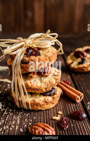 Homemade whole wheat oatmeal cookies with pecan nuts, dried cranberries and honey