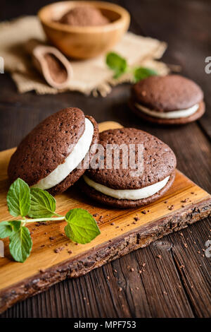 Traditional chocolate Whoopie pies filled with vanilla butter cream Stock Photo