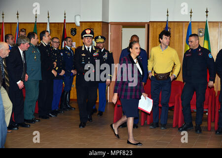 Mrs. Robin Smith (center), political advisor to the U.S. Army Africa Commanding General, Brig. Gen. Giovanni Pietro Barbano (left), Center of Excellence for Stability Police Units (CoESPU) director and U.S. Army Col. Darius S. Gallegos (rear), CoESPU deputy director arrive at the conference room for the graduation ceremony of the 14th Protection of Civilians Course at the CoESPU in Vicenza, Italy, February 21, 2017. (U.S. Army Photo by Visual Information Specialist Paolo Bovo/released)