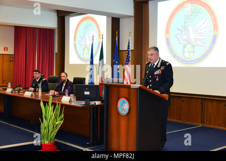 Commanding General, Brig. Gen. Giovanni Pietro Barbano (right), Center of Excellence for Stability Police Units (CoESPU) director, addresses dignitaries and guests from Europe, Africa, Italy and the U.S. during the graduation ceremony of the 14th Protection of Civilians Course at the CoESPU in Vicenza, Italy, Feb. 21, 2017. (U.S. Army Photo by Visual Information Specialist Paolo Bovo/released)