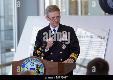 170217-N-SI684-003 CHICAGO  (Feb. 17, 2017) Vice Adm. Philip H. Cullom, deputy chief of naval operations for readiness and logistics, stands in front of the Lt. Cmdr. Edward “Butch” O’Hare exhibit in Terminal Two of Chicago’s O’Hare International Airport and retells the events and actions that led to Butch O’Hare’s remarkable flight where he single-handedly shot down five enemy aircraft and saved lives aboard the USS Lexington during World War II.  (U.S. Navy photo by Lt. Cmdr. Jeffrey S. Gray/Released) Stock Photo